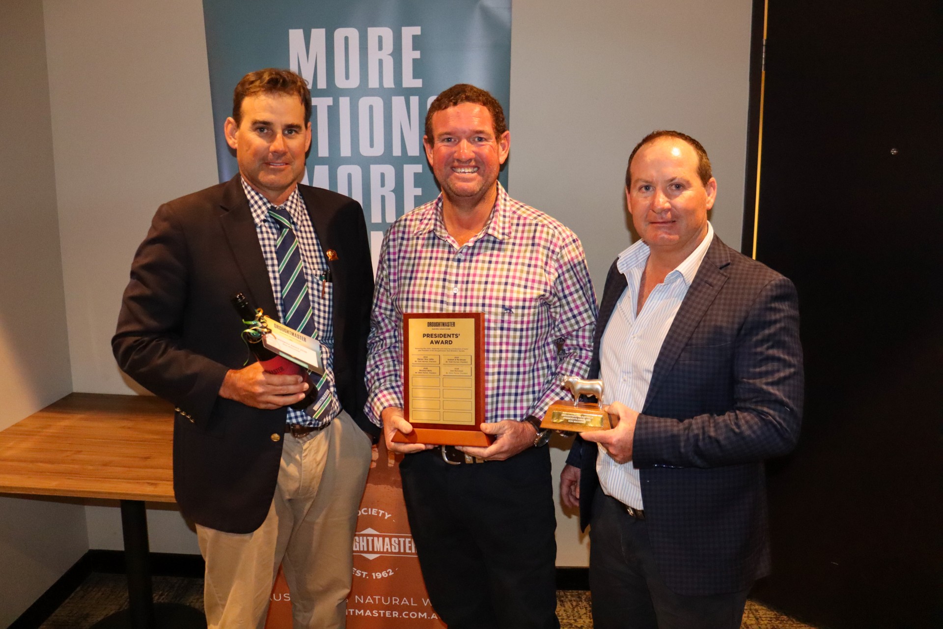 Don McConnel accepts the 2026 Droughtmaster President’s Award at the Ekka. Pictured: Droughtmaster Australia President Steve Farmer, Don McConnel of Mt Brisbane Droughtmasters, and CEO Simon Gleeson.